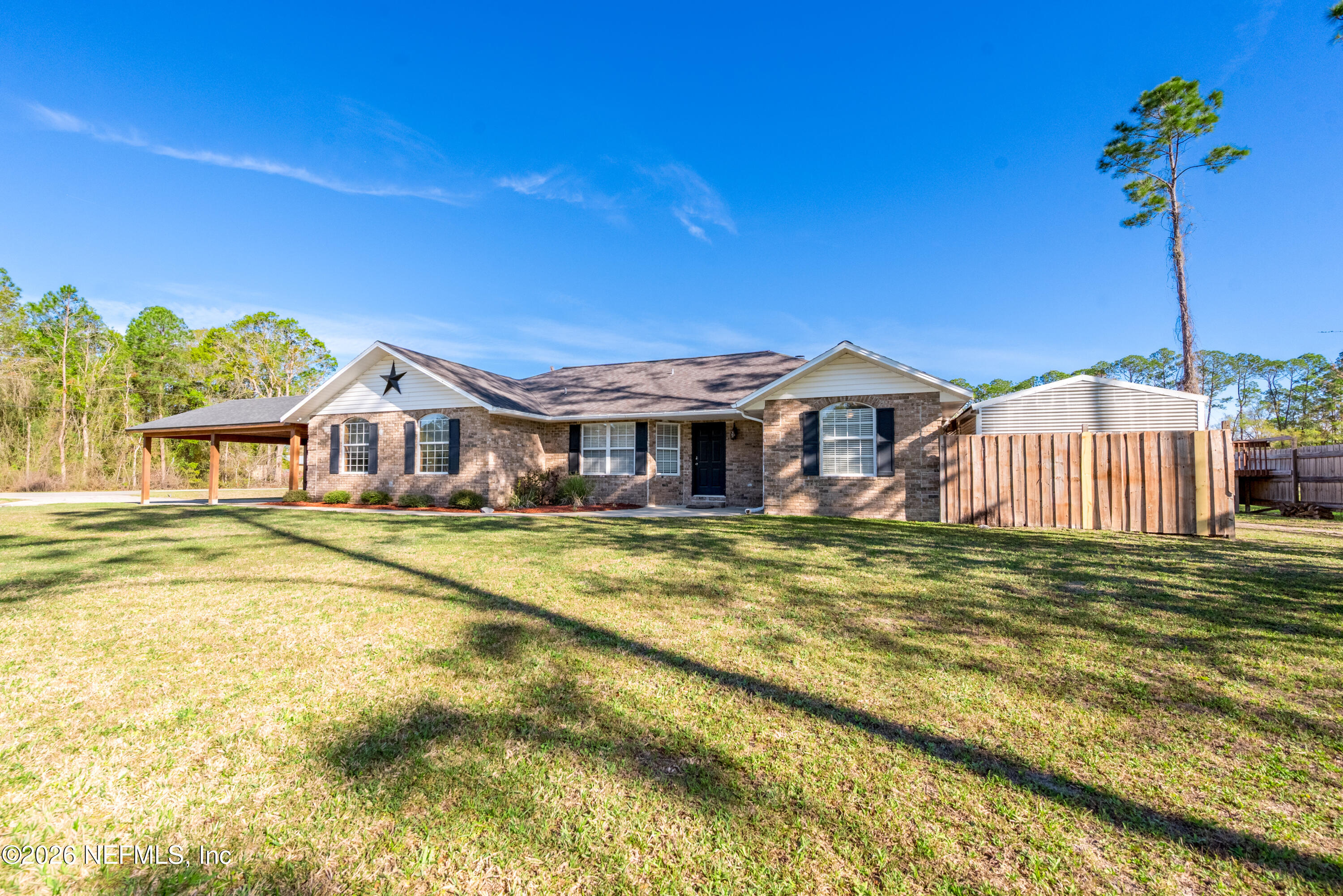 1659 Highway 230 Starke, FL 32091 - Photo 32 of 48 a front view of a house with a garden