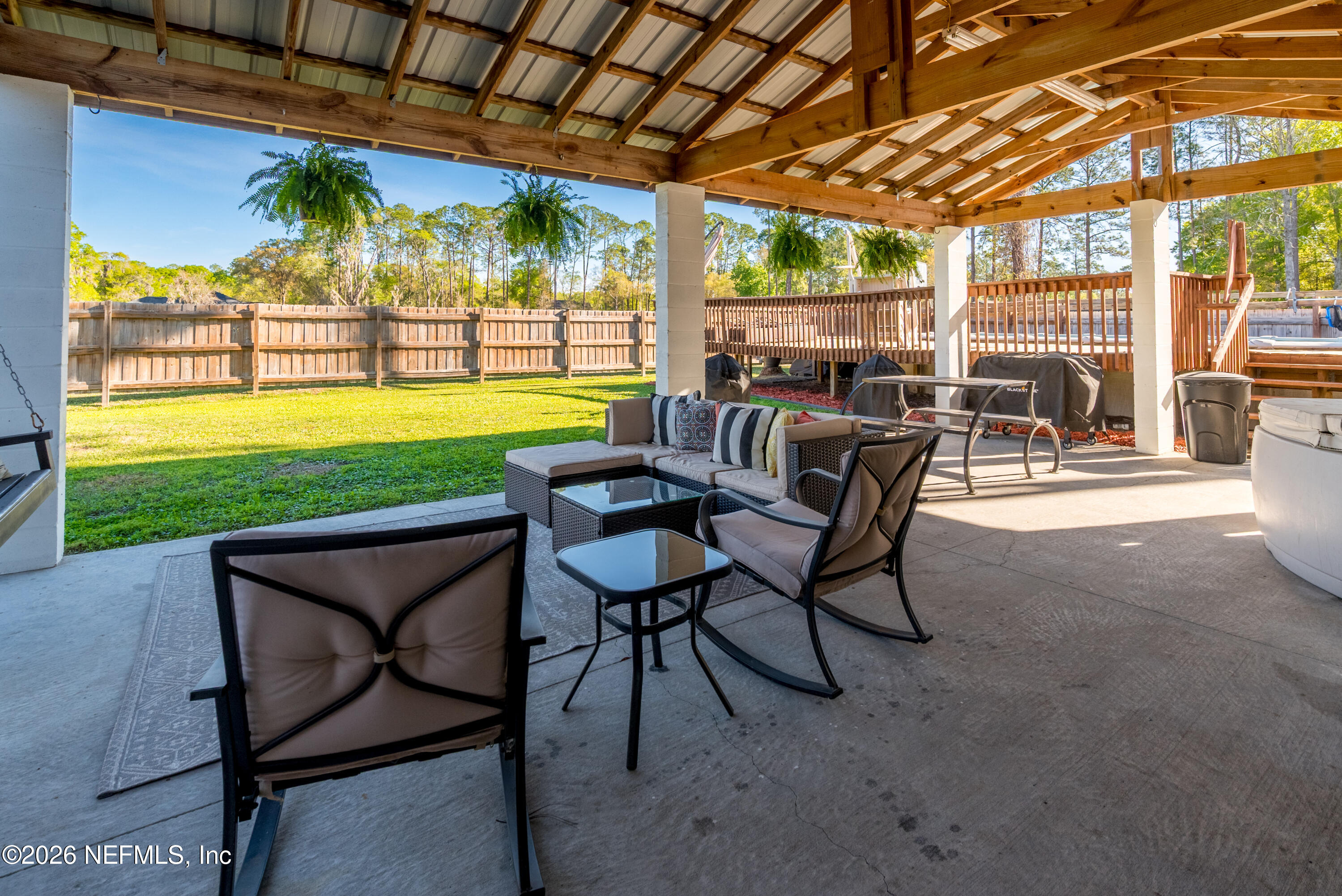 1659 Highway 230 Starke, FL 32091 - Photo 4 of 48 a view of a patio with a table chairs and a backyard