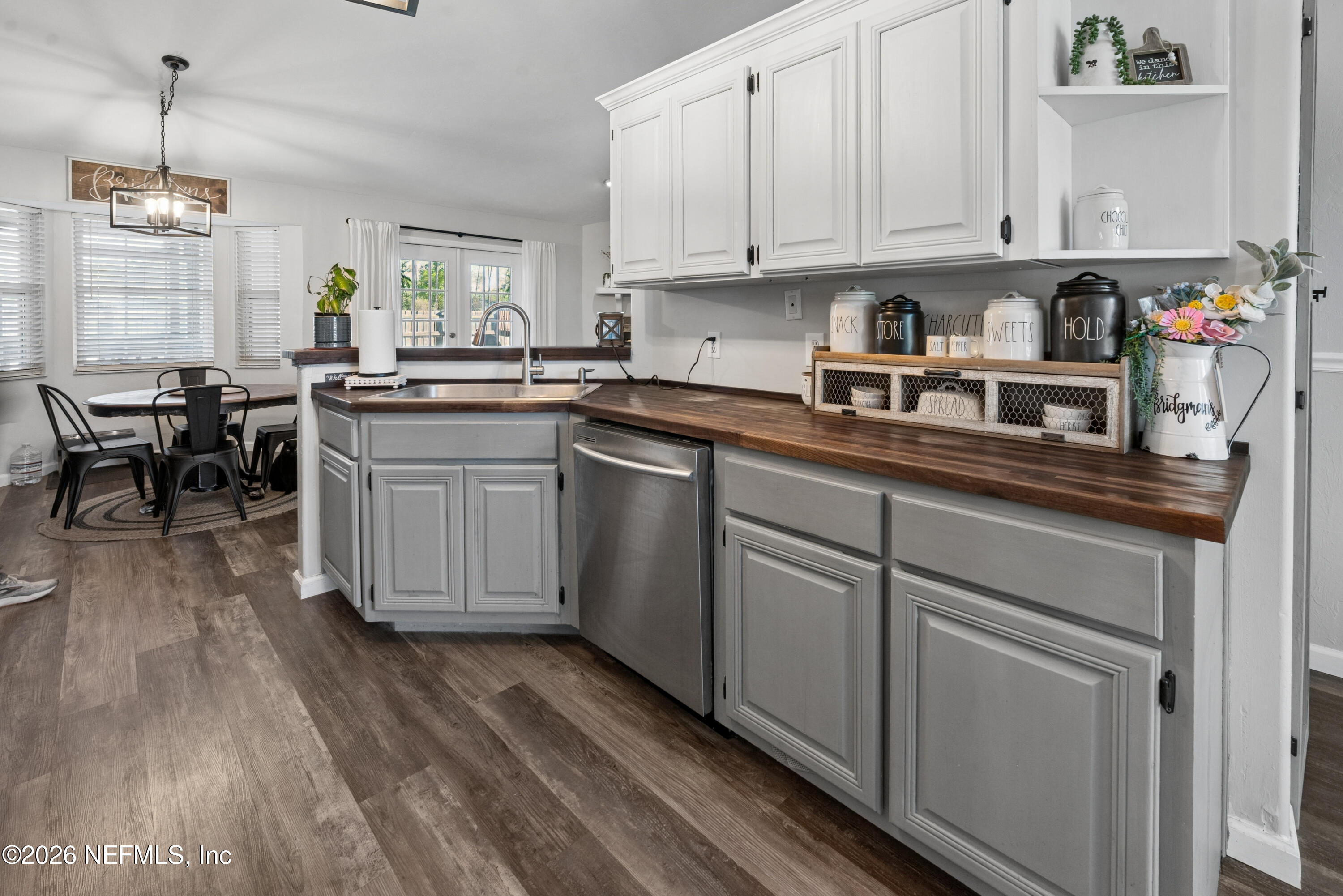 1659 Highway 230 Starke, FL 32091 - Photo 9 of 48 a kitchen with cabinets appliances and a wooden floor