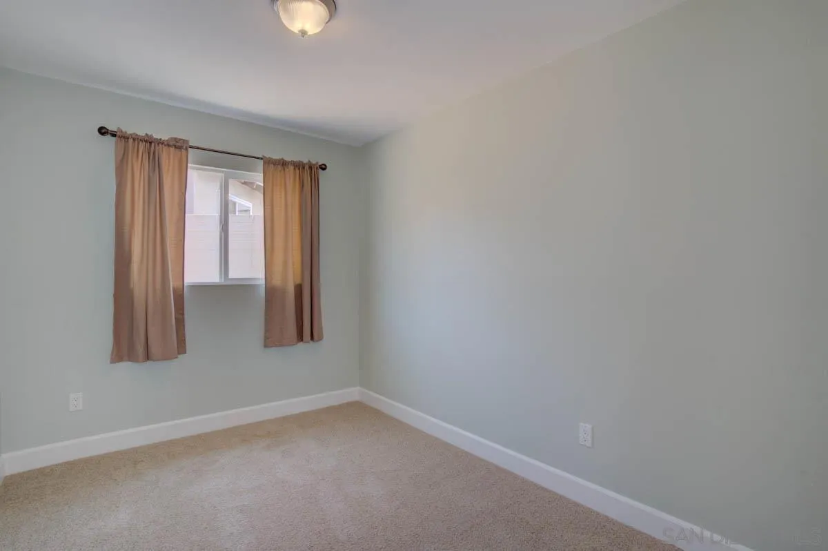 9762 Domer Road Santee, CA 92071 - Photo 19 of 34 a view of an empty room with window and closet area