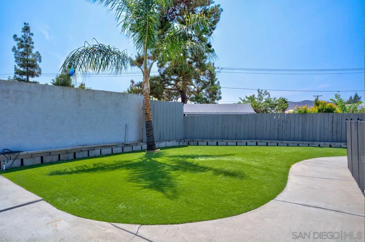 9762 Domer Road Santee, CA 92071 - Photo 23 of 34 a view of a backyard with a garden
