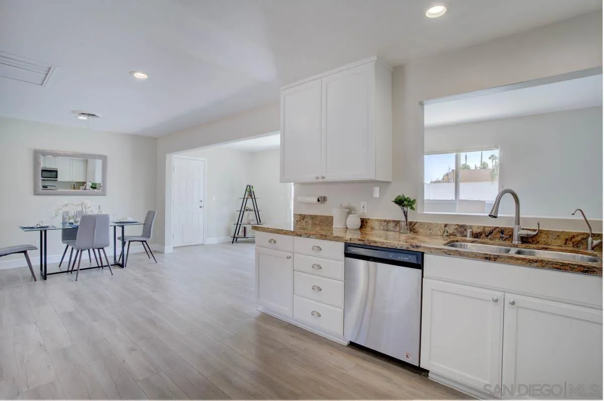 9762 Domer Road Santee, CA 92071 - Photo 7 of 34 a kitchen with sink and cabinets
