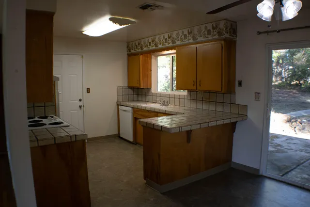 a kitchen with a stove and a microwave