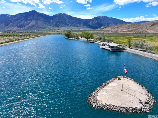 an aerial view of a house with a lake view