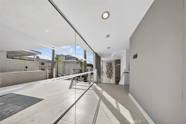 a living room with furniture kitchen view and a table