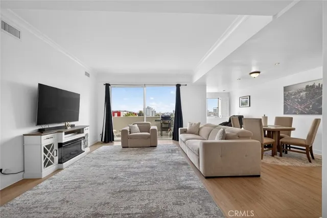 a kitchen with stainless steel appliances kitchen island sink refrigerator and stove