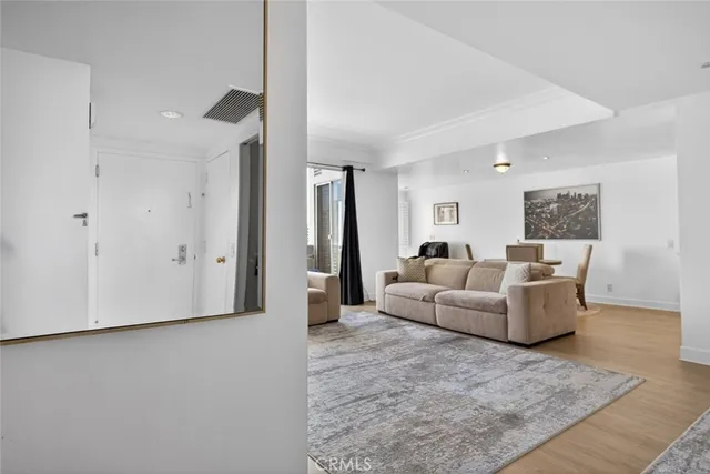 a kitchen with granite countertop wooden cabinets and a stove top oven