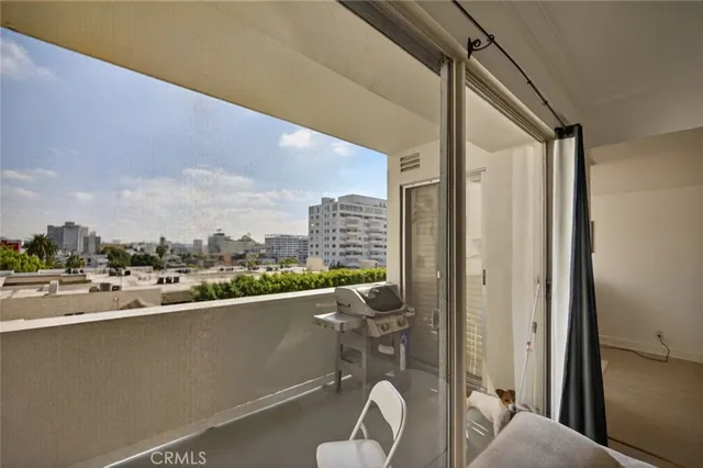 a large kitchen with stainless steel appliances granite countertop a lot of counter space and a sink