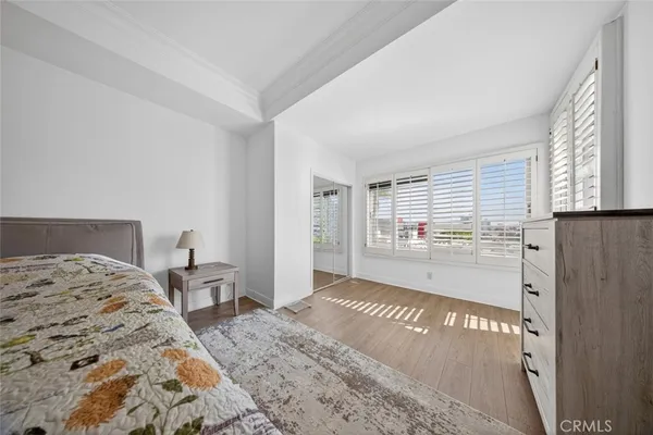 a en suite bathroom with a granite countertop sink and a mirror