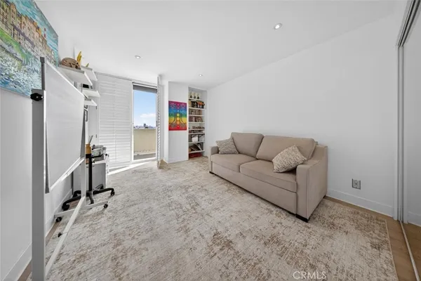 a view of a hallway with washer and dryer