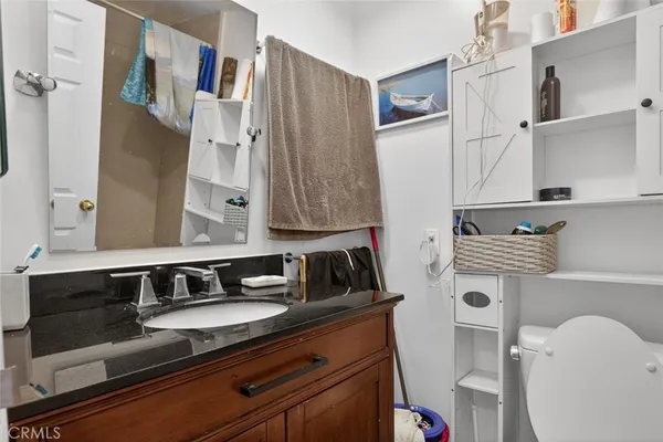 a view of a balcony with furniture