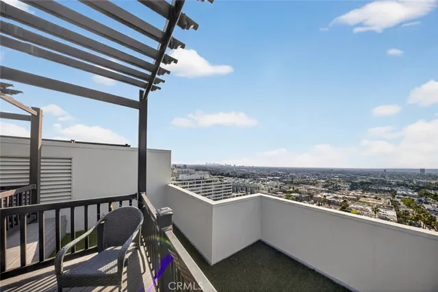 a large kitchen with stainless steel appliances a sink and cabinets