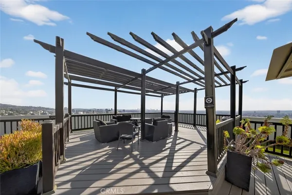 a view of a swimming pool with outdoor seating