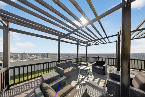 a view of a swimming pool with a roof deck