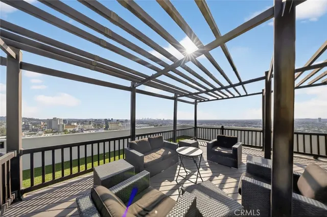 a view of a swimming pool with a roof deck