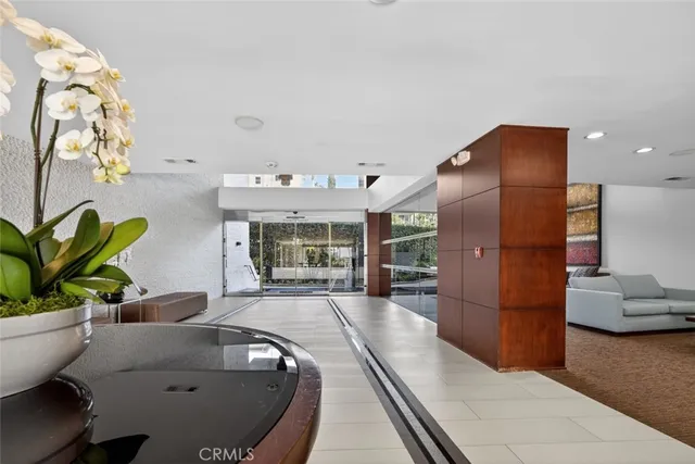 a view of a hallway with stairs