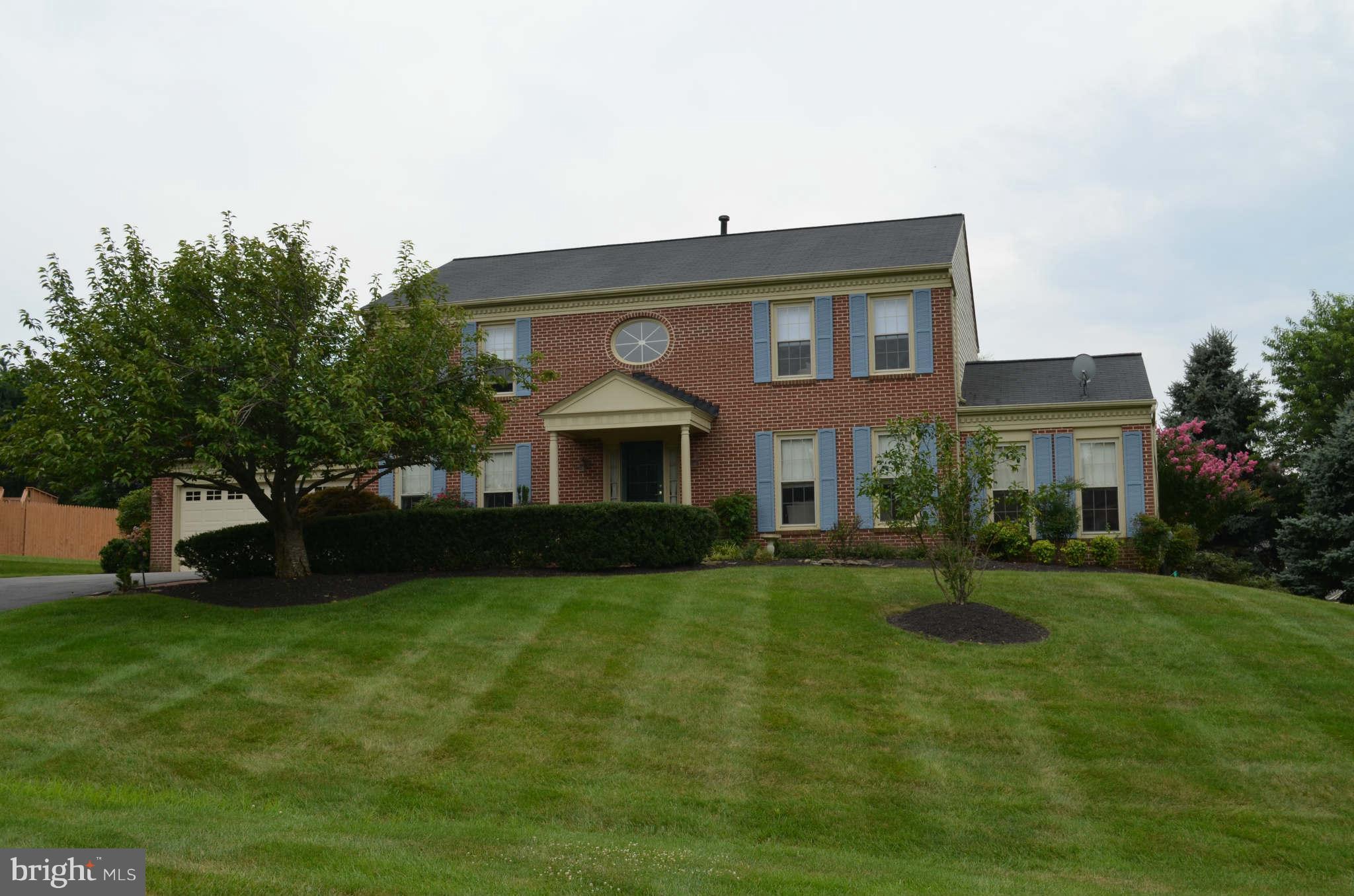 2105 Steuben Way Silver Spring, MD 20905 - Photo 1 of 10 a front view of a house with a garden