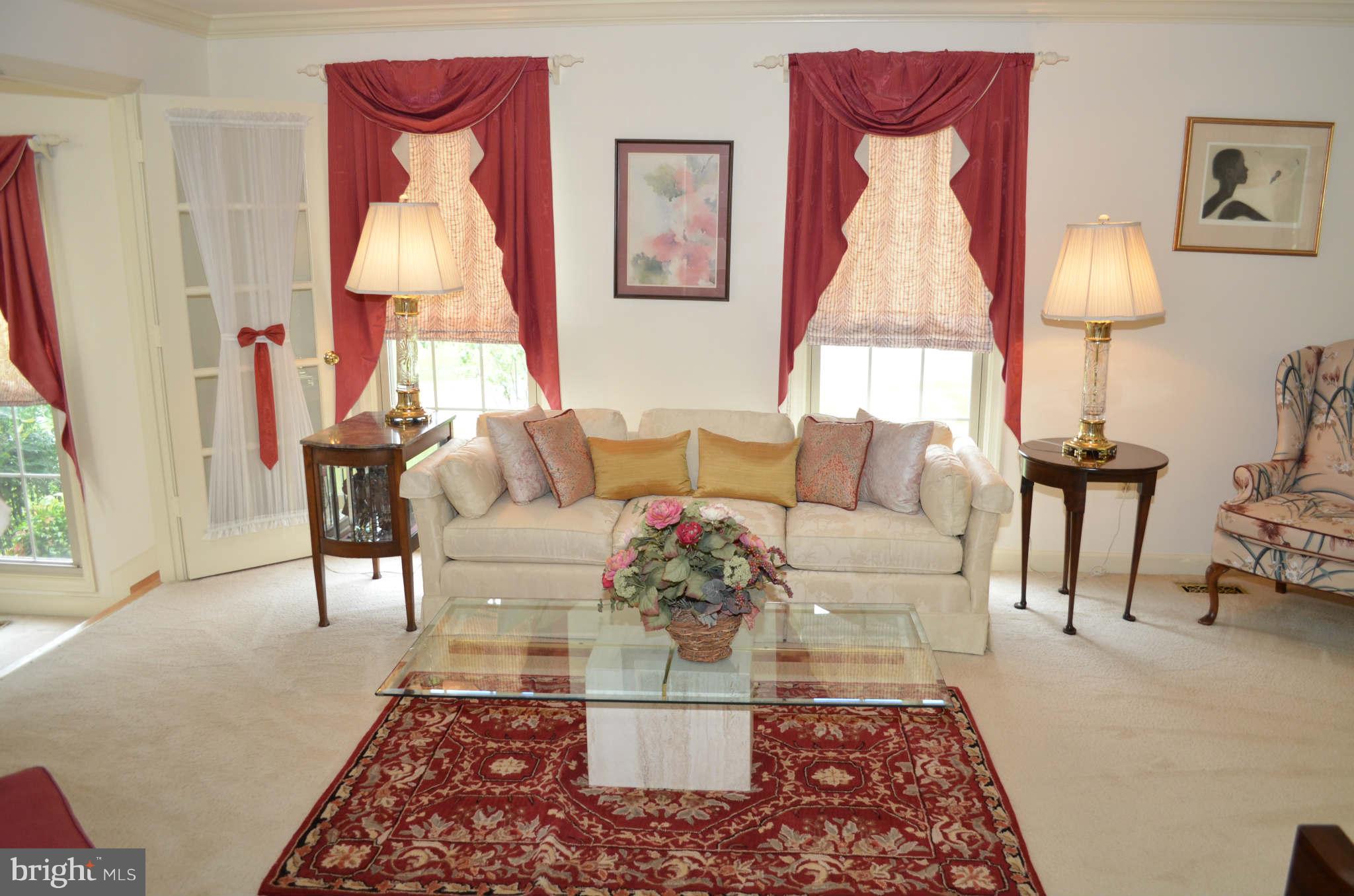 2105 Steuben Way Silver Spring, MD 20905 - Photo 3 of 10 a living room with furniture and a lamp
