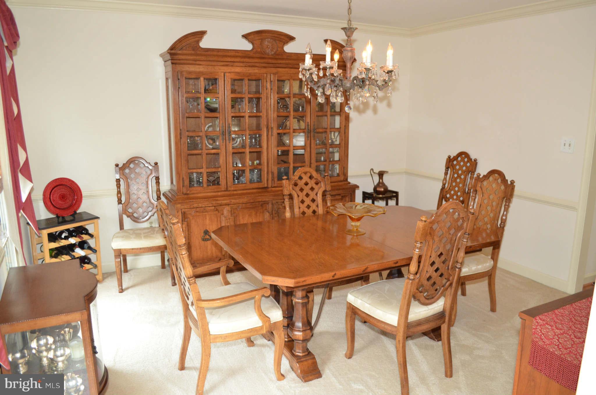 2105 Steuben Way Silver Spring, MD 20905 - Photo 5 of 10 a view of a dining room with furniture and chandelier