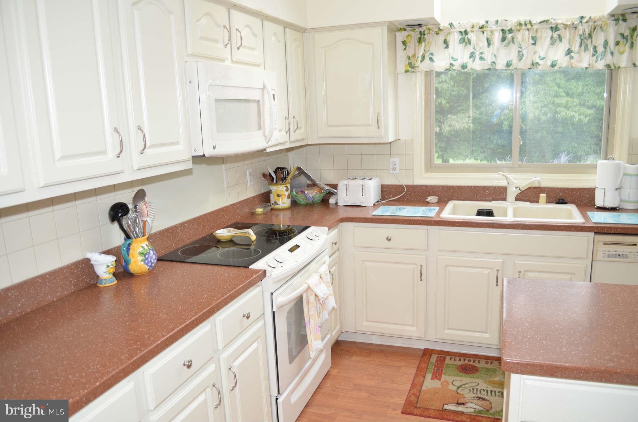 2105 Steuben Way Silver Spring, MD 20905 - Photo 6 of 10 a kitchen with a sink stove and cabinets