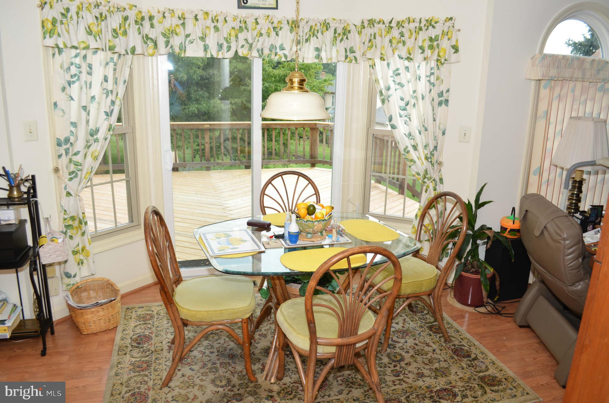 2105 Steuben Way Silver Spring, MD 20905 - Photo 9 of 10 a view of a dining room with furniture window and outside view
