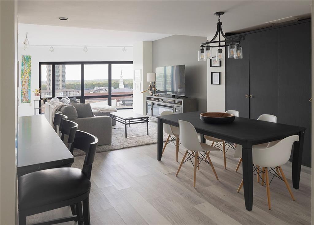 3475 Oak Valley Road Northeast, Unit 1450 Atlanta, GA 30326 - Photo 2 of 28 a living room with furniture floor to ceiling window and wooden floor