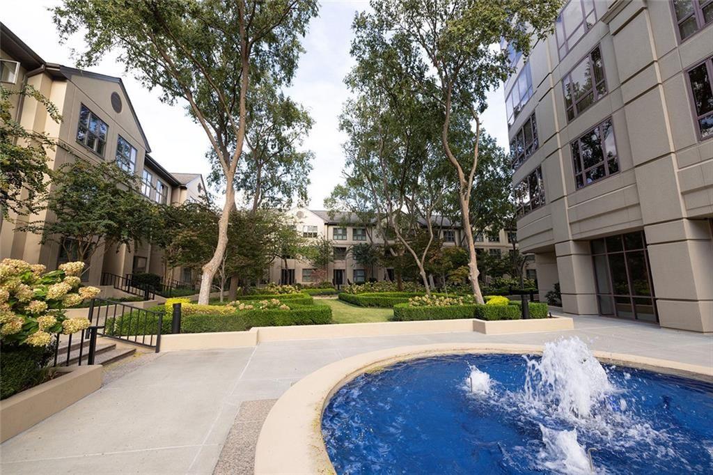 3475 Oak Valley Road Northeast, Unit 1450 Atlanta, GA 30326 - Photo 21 of 28 a view of a building with a yard