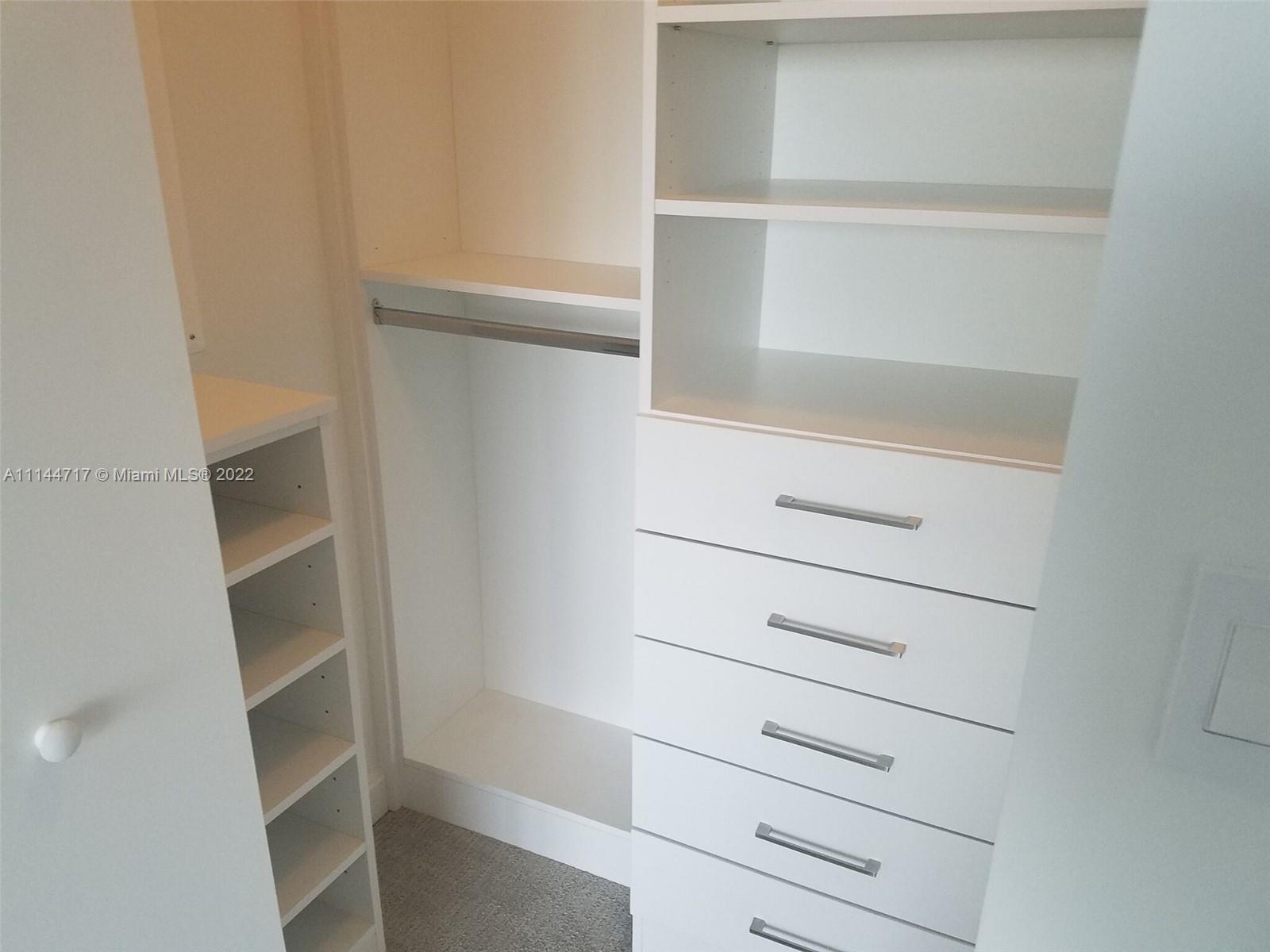 45 Southwest 9th Street, Unit 3103 Miami, FL 33130 - Photo 13 of 23 a view of an empty walk in closet