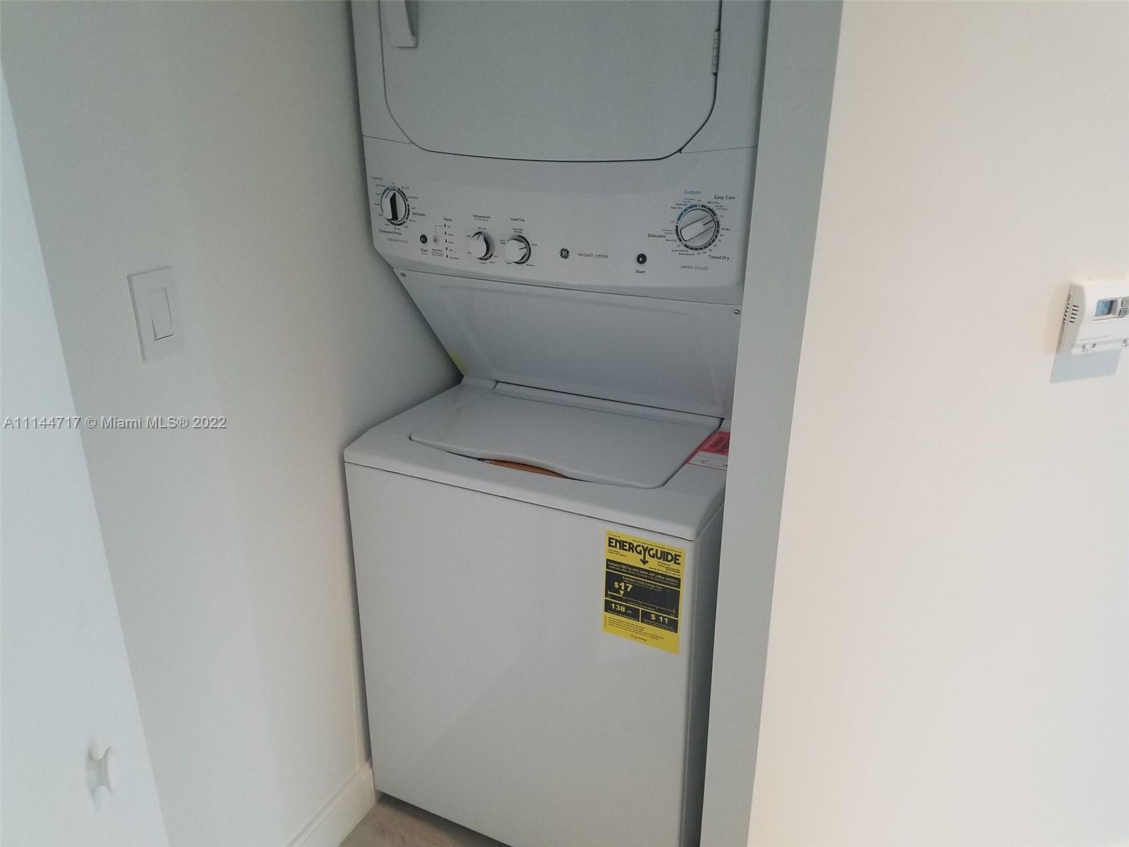 45 Southwest 9th Street, Unit 3103 Miami, FL 33130 - Photo 22 of 23 a utility room with dryer and washer