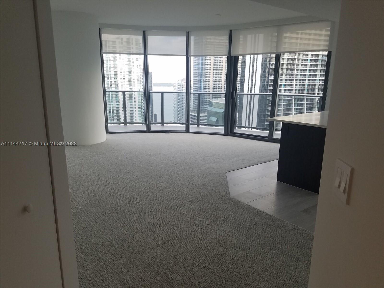 45 Southwest 9th Street, Unit 3103 Miami, FL 33130 - Photo 6 of 23 a view of an empty room with a balcony