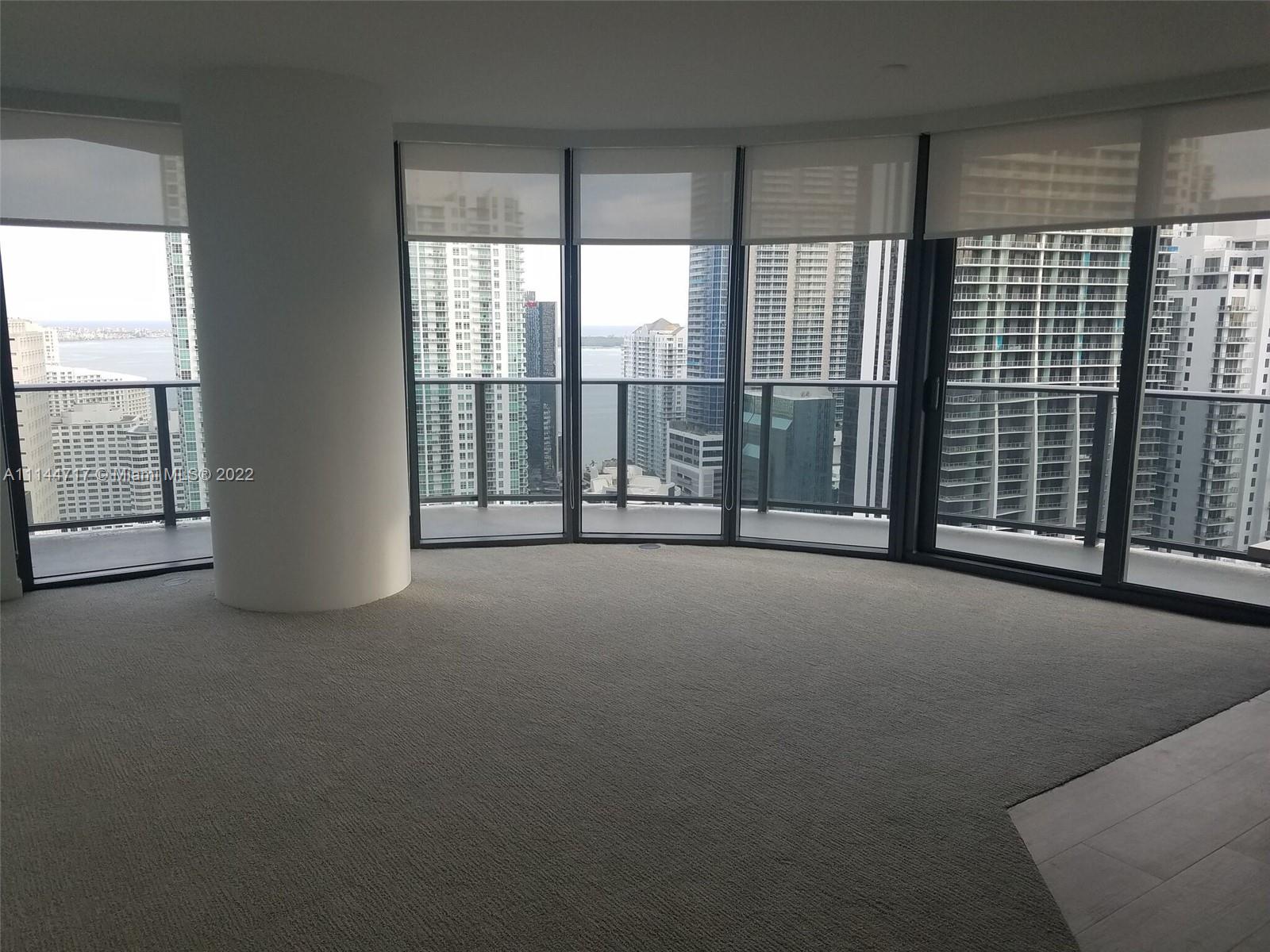 45 Southwest 9th Street, Unit 3103 Miami, FL 33130 - Photo 7 of 23 a view of room with floor to ceiling windows