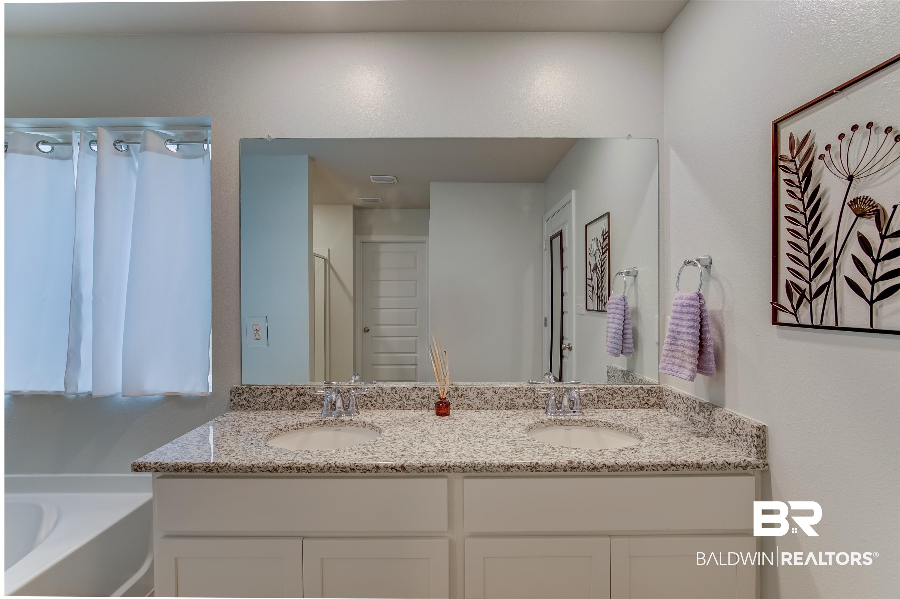 8033 Irwin Loop Daphne, AL 36526 - Photo 27 of 38 Double vanity featuring granite-finish countertops, undermount sinks, and chrome-finish faucets