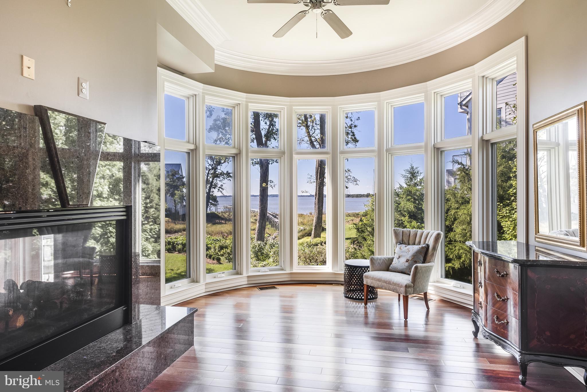 1407 A Sharps Point Road Annapolis, MD 21409 - Photo 22 of 33 Main level bedroom with views and fireplace