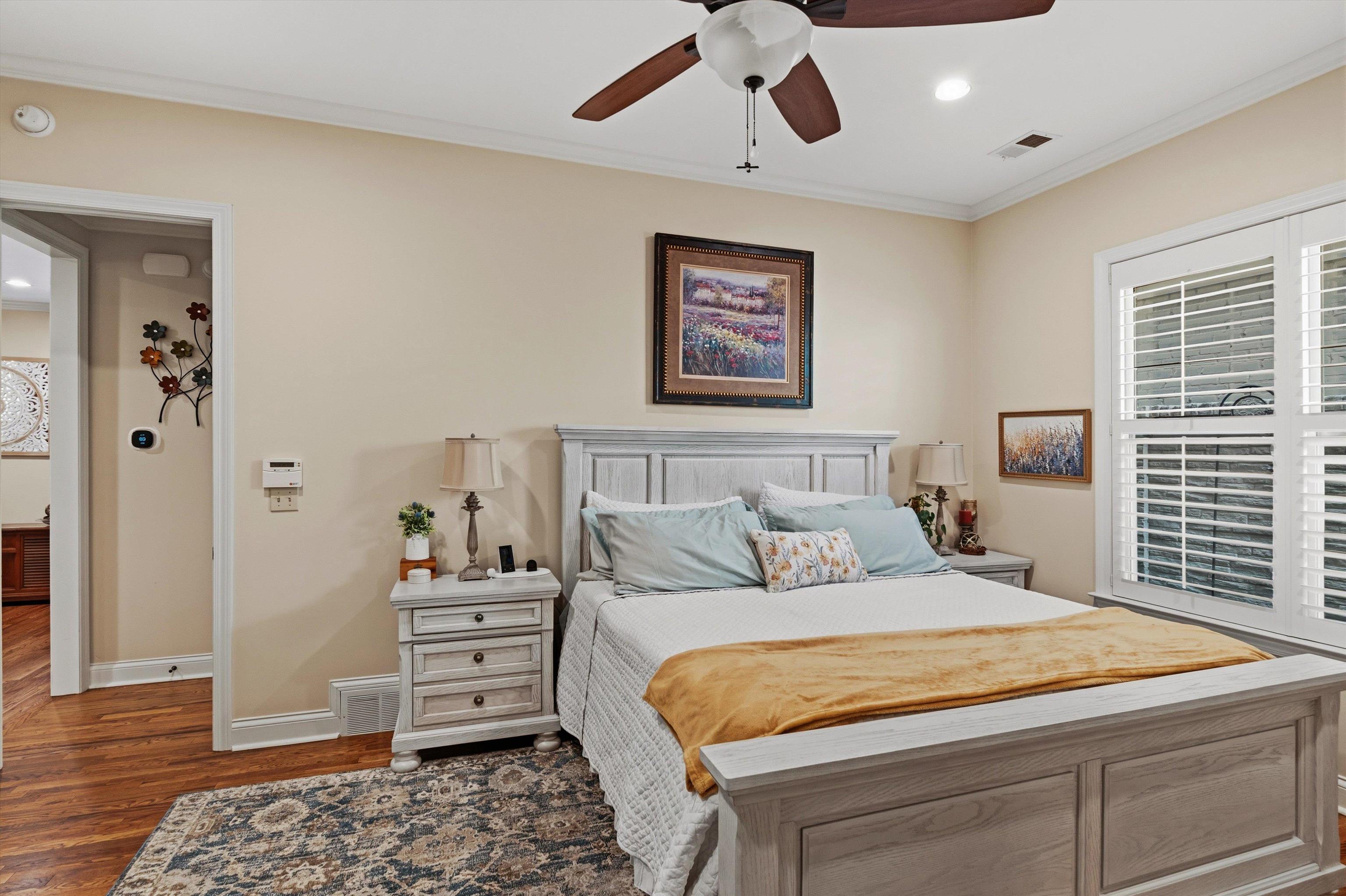 1011 Ostlers Way Collierville, TN 38017 - Photo 16 of 31 a bedroom with a bed and wooden floor
