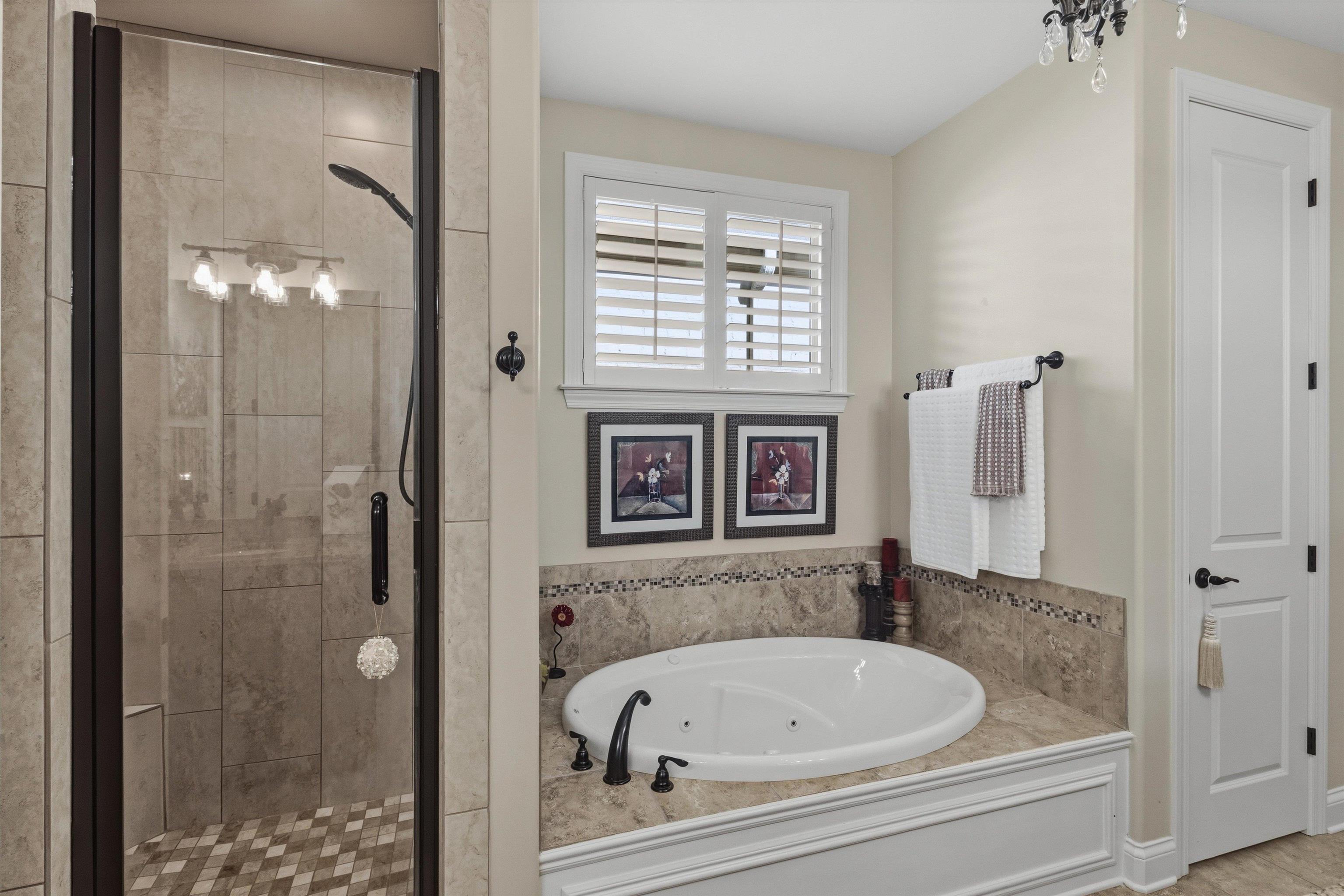 1011 Ostlers Way Collierville, TN 38017 - Photo 19 of 31 a bathroom with a tub and a shower
