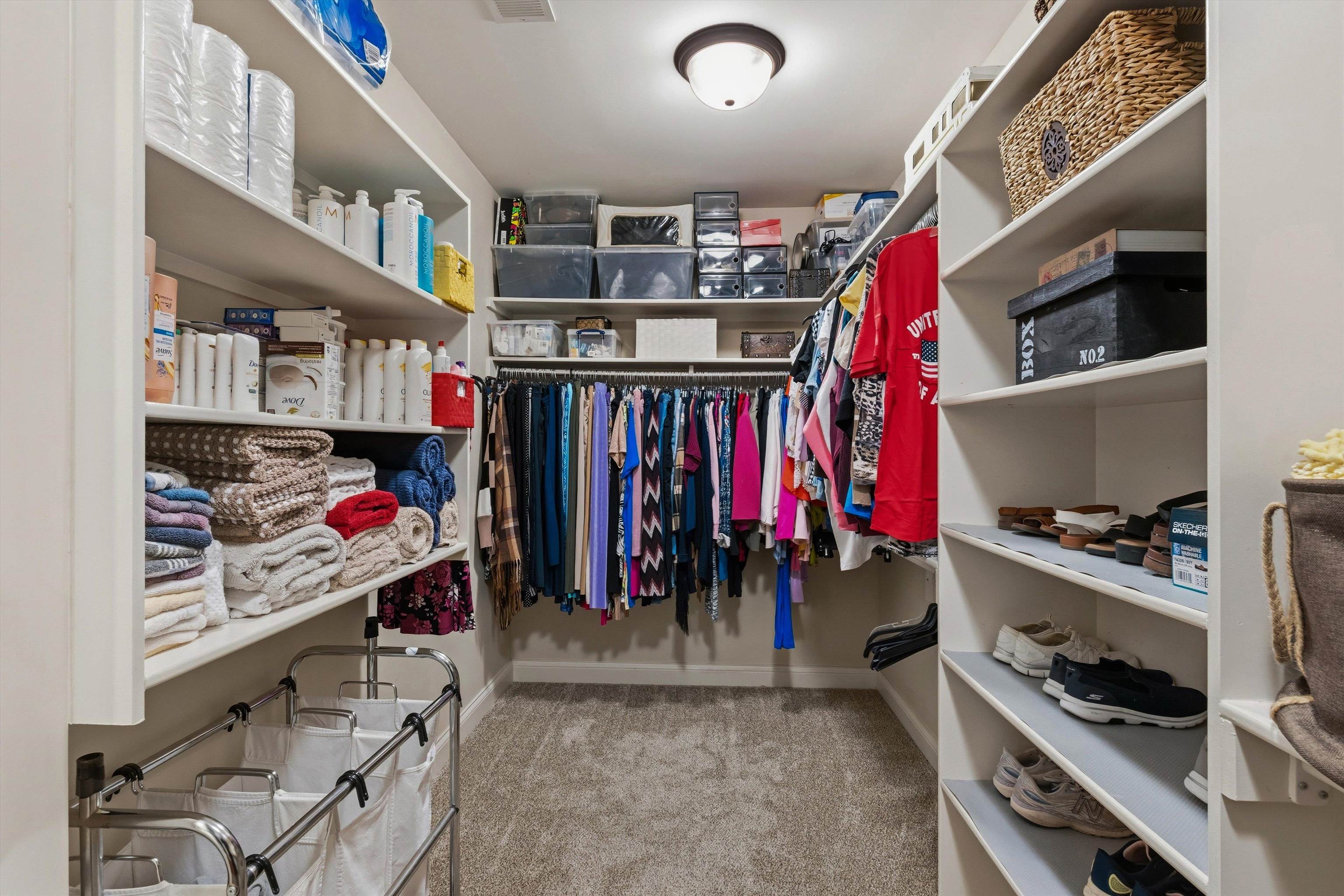1011 Ostlers Way Collierville, TN 38017 - Photo 20 of 31 a view of walk in closet with clothes and shoes