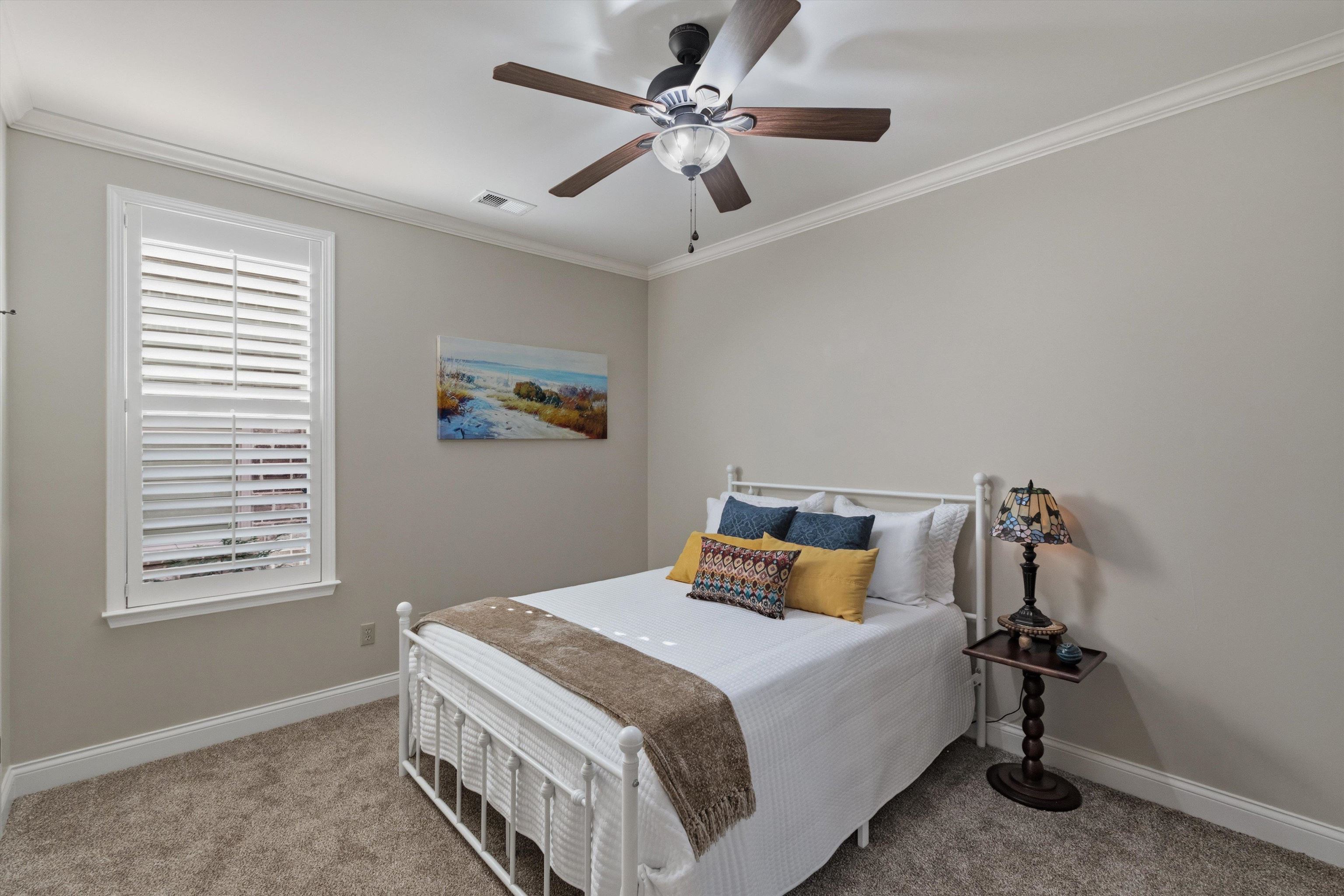 1011 Ostlers Way Collierville, TN 38017 - Photo 22 of 31 a bedroom with a bed and a chandelier