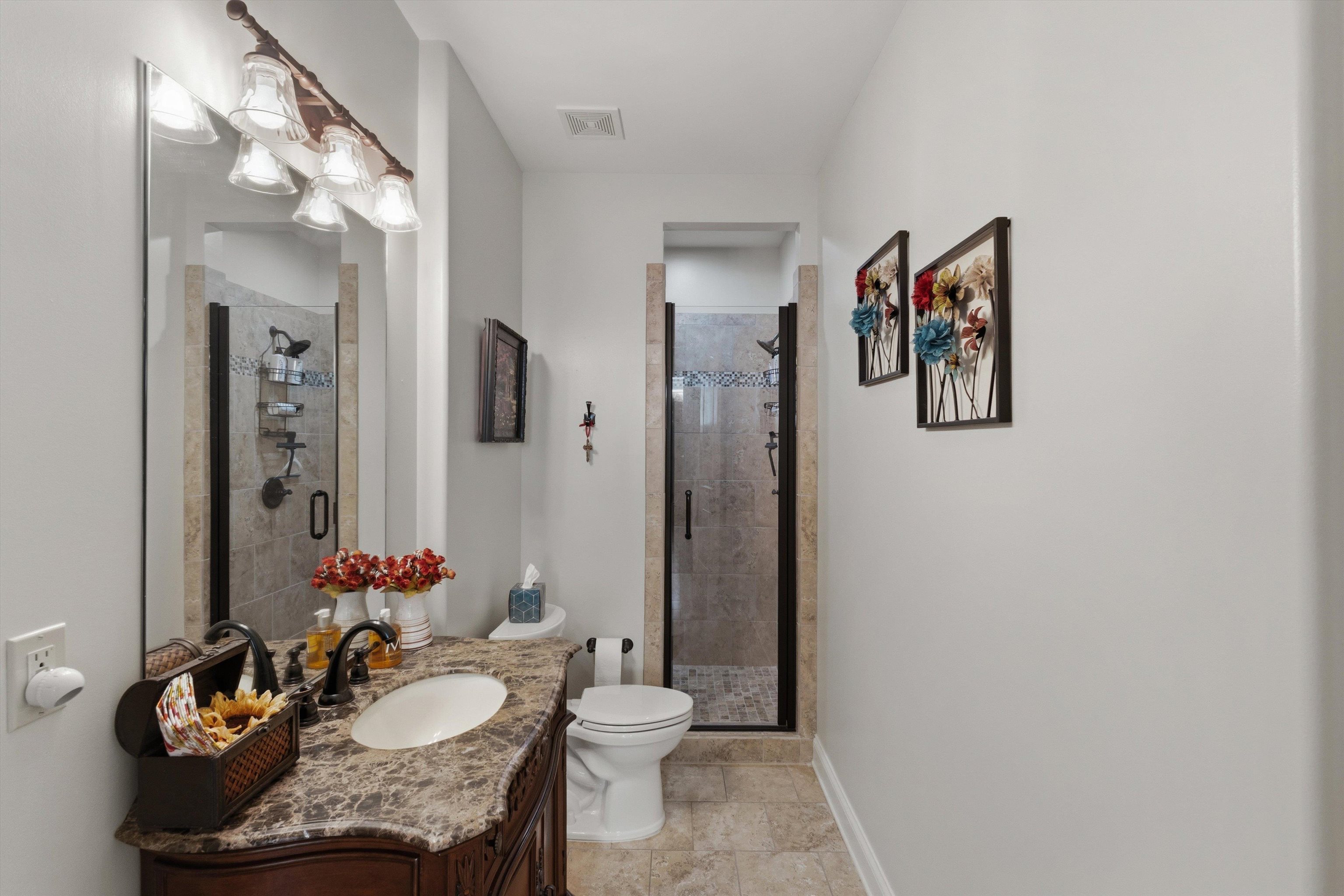 1011 Ostlers Way Collierville, TN 38017 - Photo 23 of 31 a bathroom with a granite countertop sink and a mirror