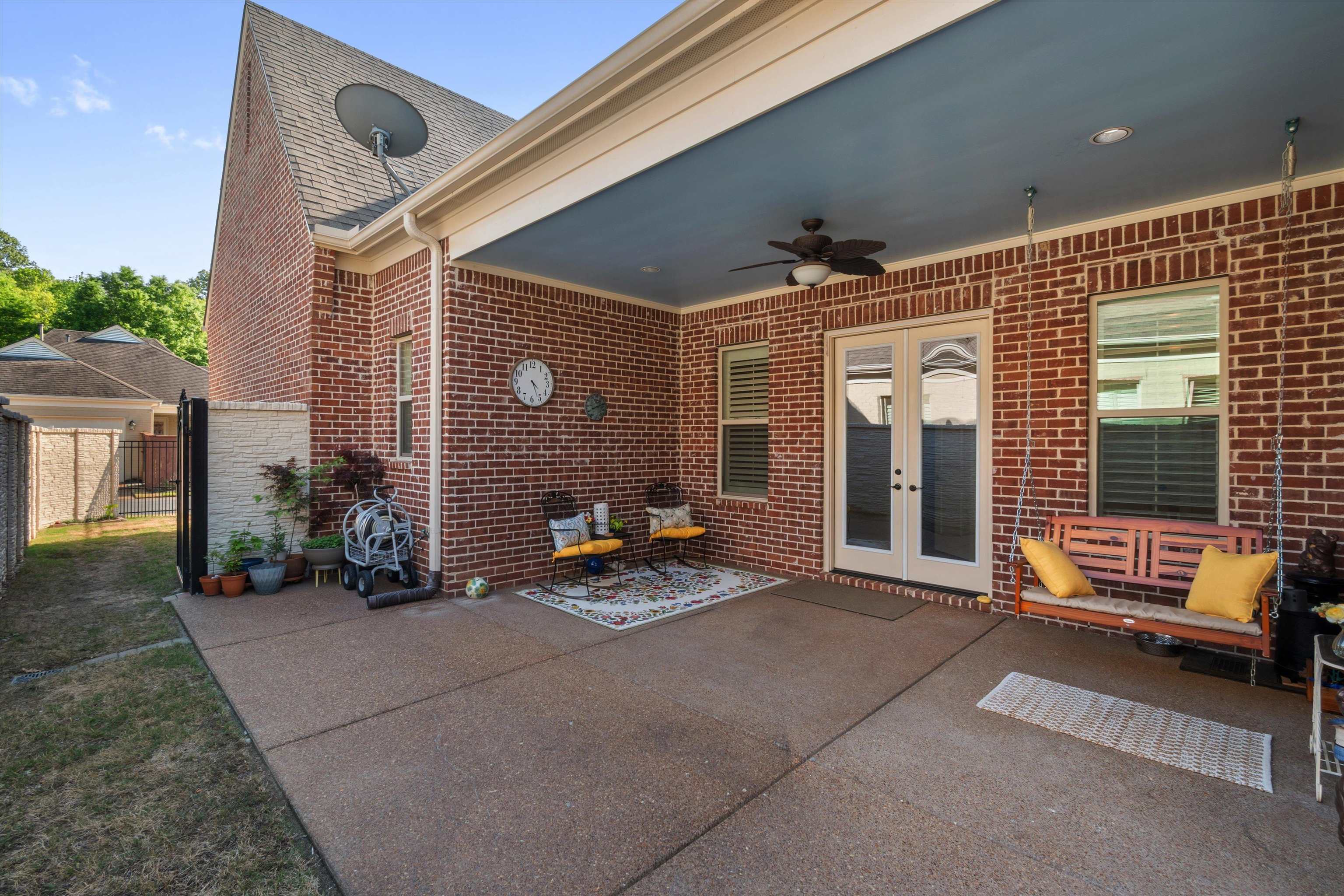 1011 Ostlers Way Collierville, TN 38017 - Photo 27 of 31 a view of a patio with couple of cars parked in front of a house
