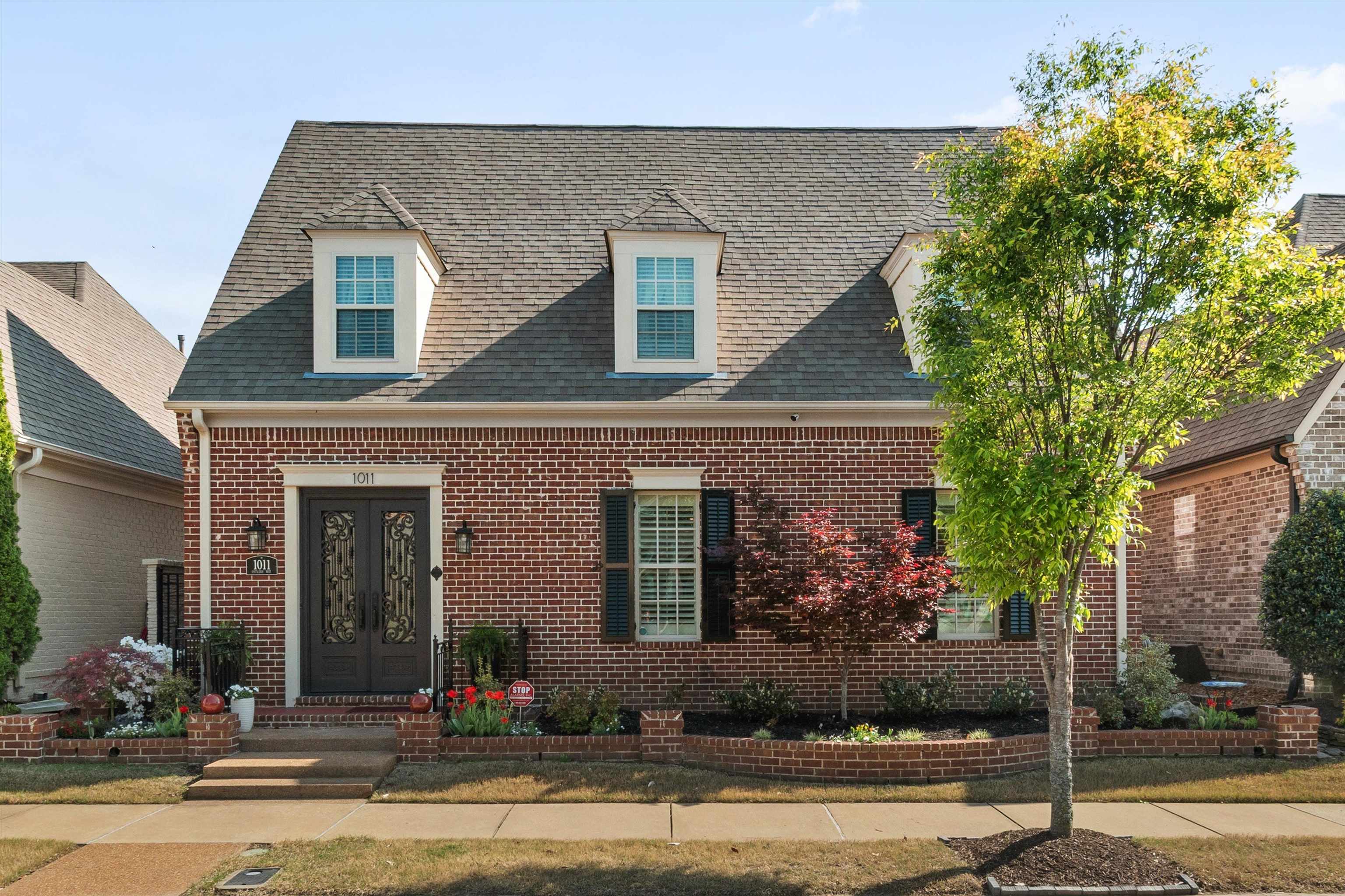 1011 Ostlers Way Collierville, TN 38017 - Photo 3 of 31 a front view of a house
