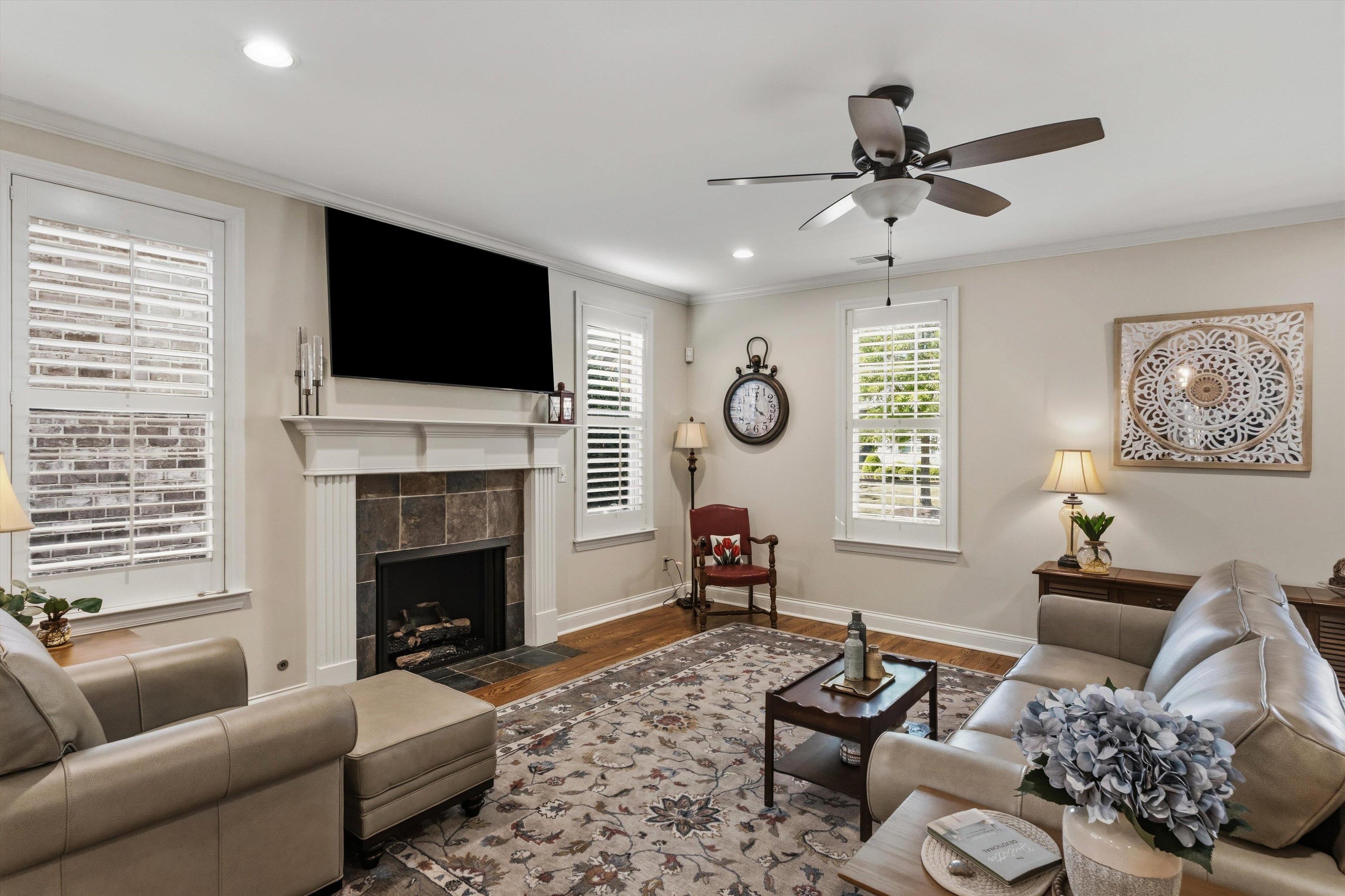 1011 Ostlers Way Collierville, TN 38017 - Photo 5 of 31 a living room with furniture a fireplace and a flat screen tv