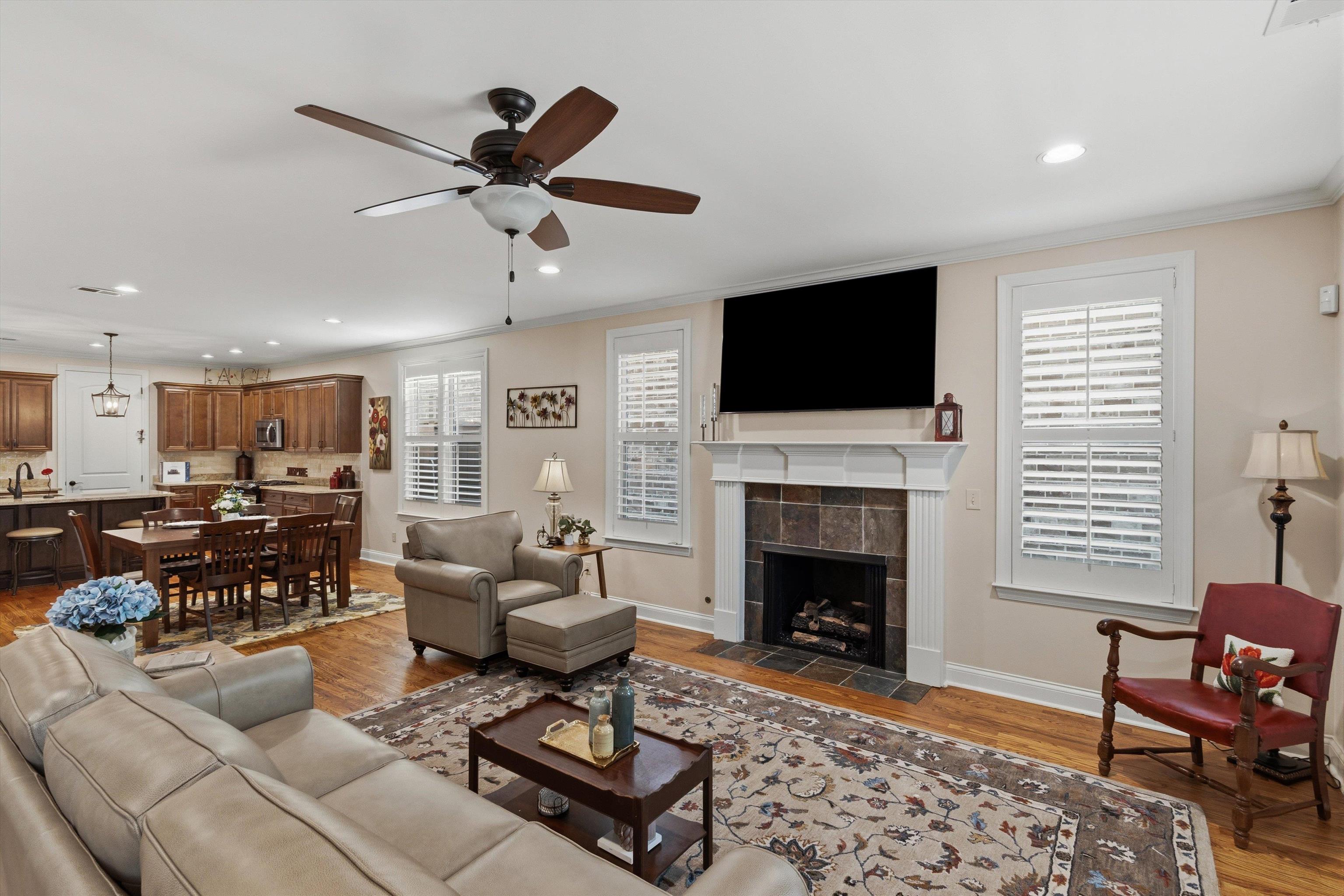 1011 Ostlers Way Collierville, TN 38017 - Photo 10 of 31 a living room with furniture a fireplace and a flat screen tv
