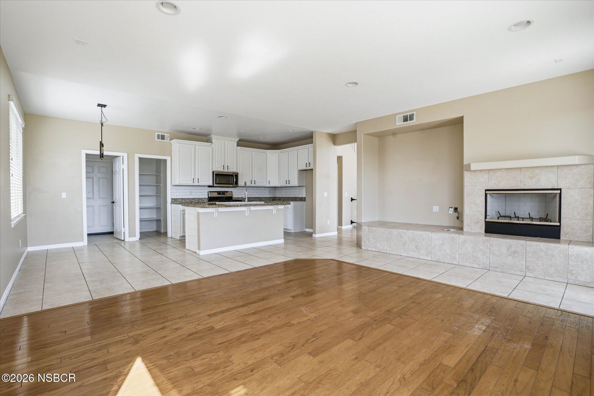 280 Rinconcito Lompoc, CA 93436 - Photo 9 of 39 a large kitchen with cabinets and wooden floor