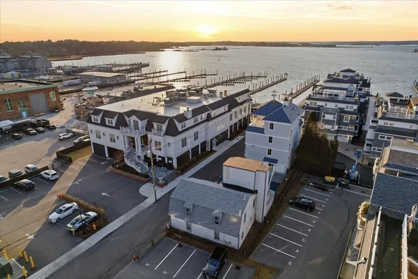 an aerial view of a house with a ocean view