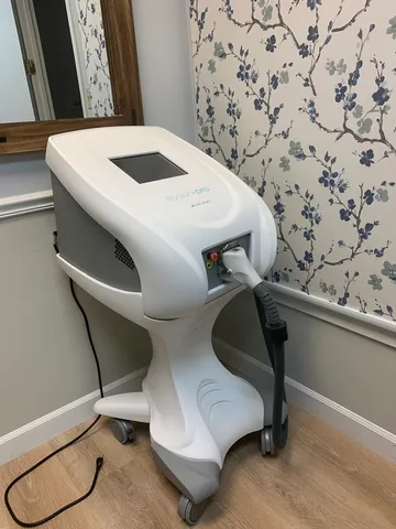 a living room with furniture a rug and a window
