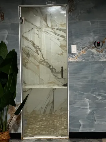 a bathroom with a sink mirror and vanity