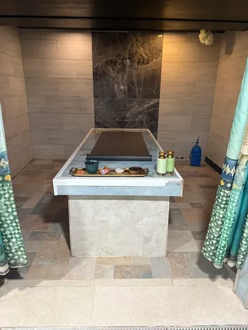 a bathroom with a shower and toilet