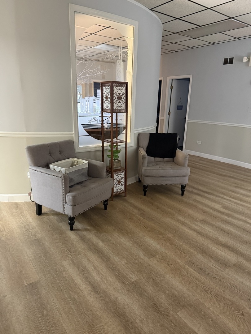 8855 South Roberts Road Hickory Hills, IL 60457 - Photo 29 of 32 a living room with furniture and a flat screen tv