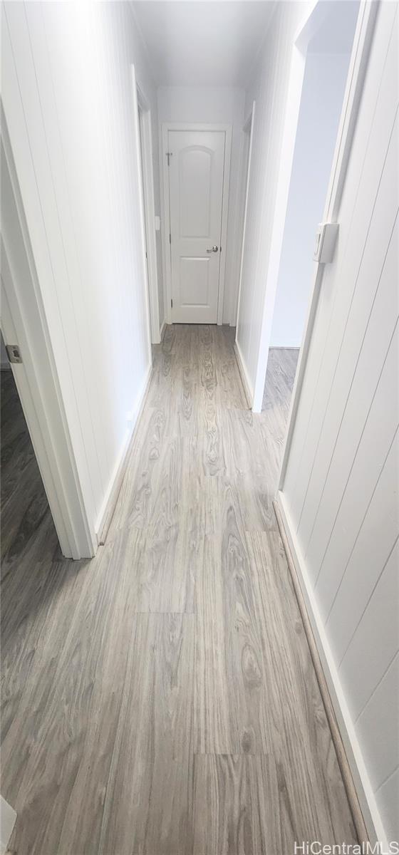 41-978B Waikupanaha Street, Unit B4 Waimanalo, HI 96795 - Photo 14 of 18 a view of a hallway in a house with wooden floor