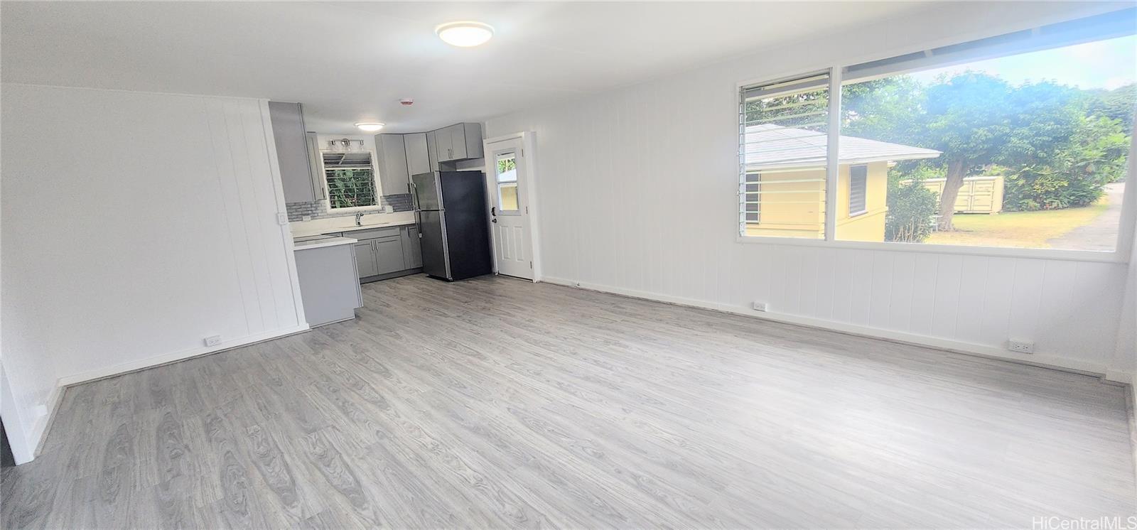 41-978B Waikupanaha Street, Unit B4 Waimanalo, HI 96795 - Photo 2 of 18 a view of a kitchen with a sink dishwasher and refrigerator